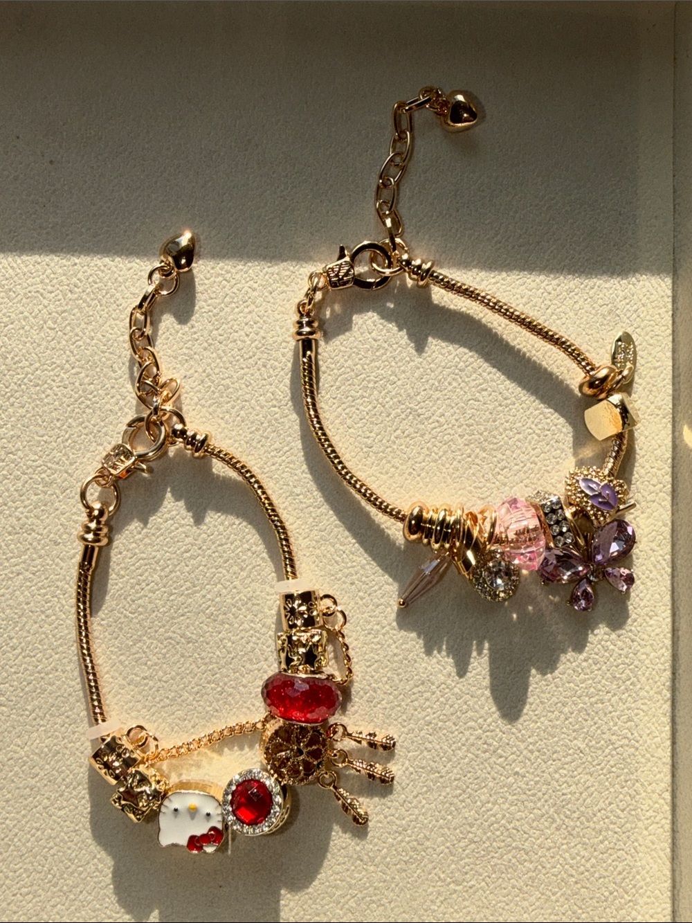 Gold-Tone Charm Bracelet with Red and Purple Accents - Set of 2